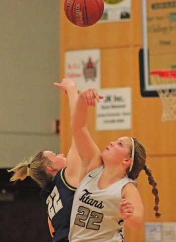 The season finally begins! Kasey Stegman and North Border’s Keira Moore fight for the ball in the opening tip of the 2020-2021 Girls Basketball Season. VNV Photo by Lesa Van Camp