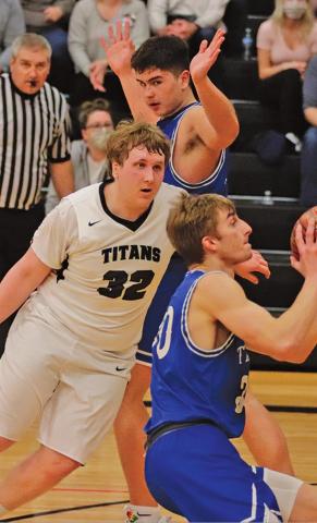 Lukas Pastorek guards one of the Hatton Northwood Thunder players in the last regular season game in Drayton last week. VNV Photo by Lesa Van Camp