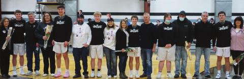Pictured left to right are the Titans Boys Basketball Senior players and their parents: Sophia Swanson, Alex Swanson, Bart Swanson, Lindsay Pollestad, Gage Pollestad, Jeremy Kartes, Caleb Kartes, Mary Kartes, Kristi Johnson, Sam Johnson, Lynn Johnson, Joey Bjornson, Marvin Bjornson, Les Backer, Tyson Backer, and Martha Fedje. VNV Photo by Lyle Van Camp