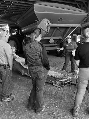 Angie Johnson, NDSU Extension farm and ranch safety specialist, explains safety procedures around an auger. (NDSU photo)