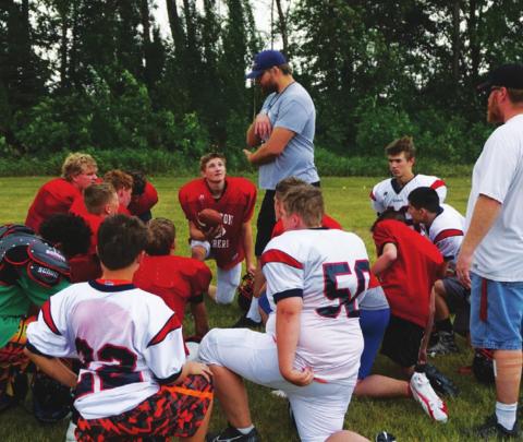 First year head coach Foster visits with the team after practice on Monday morning. VNV photo by Lyle Van Camp