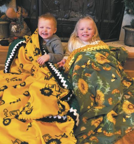 Kolter and Koldie Dahl snuggle under their new Liz’s Kozy Afghans blankets, a Christmas gift from their great-grandmother, Shirley Jensen of Drayton. Photo by Katie Dahl