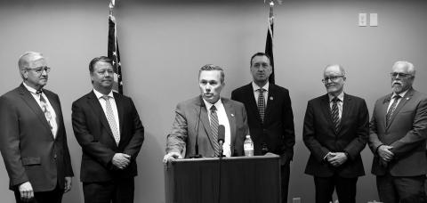 Senate Majority Leader David Hogue, R-Minot, announces a new interim Artificial Intelligence and Data Center Committee at the Capitol on June 25, 2026. Also pictured are, from left, Rep. Todd Porter, R-Mandan, Rep. Mike Nathe, R-Bismarck, Rep. Jonathan Warrey, R-Casselton, former North Dakota University System Chancellor Mark Haggerott, and Sen. Mike Wobbema, R-Valley City. (Photo by Michael Achterling/North Dakota Monitor)