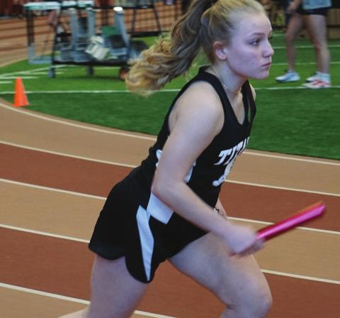 Reese Fering runs her leg of the girls 1200 meter relay at the Pembina County Indoor Track Meet last Saturday. VNV photo by Lyle Van Camp