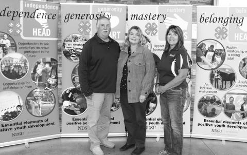 The Nelson family is recognized as a North Dakota 4-H Century Family. Pictured from left: Brent Nelson; Becky Nelson and Becky Peterson, North Dakota 4-H Foundation chair. (NDSU photo)