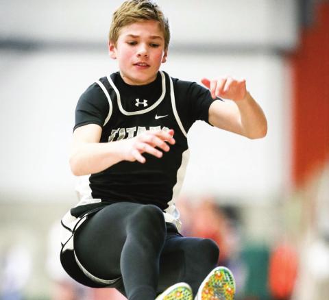 Sam Kittelson makes an effort during the long jump last Friday Night at UND. Photo by Cole Short courtesy of Hillsboro Banner