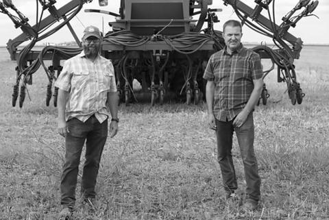Chris Walberg (left) and Tyler Zimmerman, lifelong friends who have turned to regenerative agriculture together, were featured in a mini-documentary that’s been viewed nearly 600,000 times in the past six months. Photo provided by Kiss the Ground.