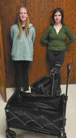 Natasha Shepard and Brooklynne Petersen pose with the carts purchased with grant funds. Photo by Shelly Quimby