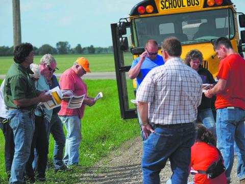 A Walsh County Soil Health Tour brought together 40 participants to learn more about soil loss, erosion and soil health in July 2023. Here, Naeem Kalwar [left side in the green shirt], a soil health specialist from the NDSU Langdon Research Extension Center, leads the talk. Photo provided by Josh Anderson, Walsh County district conservation manager.