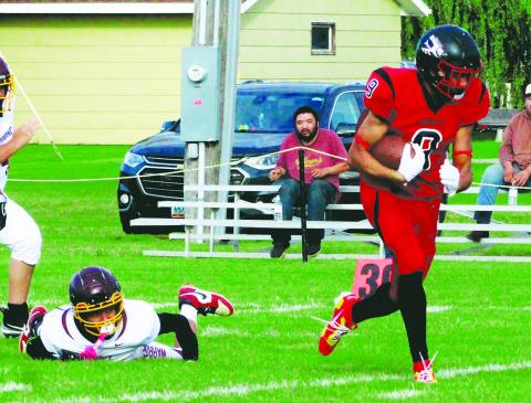 Breaking the tackle, Bomber senior tight end Mason Pollestad outruns the defense for a large gain during Saturday's game versus Mandaree. Photo by Jamie Rarick
