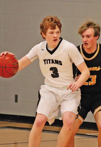 Brayden Johnson attempts to dribble around Jaguar Brock Carpenter last Tuesday night in the Drayton Gym. VNV photo by Lesa Van Camp