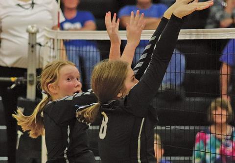 Easton Larson (l) and Kiara Aasand (r) go up for the block against the Hillsboro - Central Valley Burros last Thrusday night in the Drayton gym. VNV Photo by Lesa Van Camp