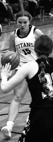 Aleah Pokrzywinski drives the ball down the court in a heated game Saturday. Photo by Mike Steinfeldt.