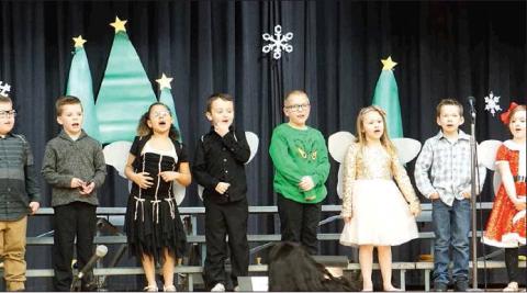 The 1st Graders sang with gusto during their Winter concert earlier this month. VNV photo by Lyle Van Camp