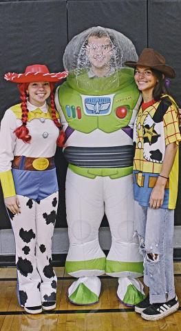 Seniors Hope Patterson, Maddox Oihus, and Mikala McCoy dress as Toy Story characters Jessie, Buzz Lightyear and Woody during Character Day. Photo by Jamie Rarick