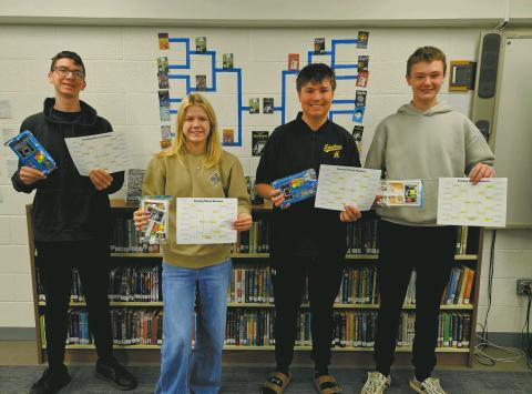 In the month of Mch,ar the Drayton High School Library put on a 'Best Bracket' contest, with students and staff voting on their favorite books after filling out brackets with their predicted results. The competition was tough, but the overall choice for best book was The Outsiders, by S.E. Hinton. Winners of the bracket contest are pictured as follows: Jonah, Alyssa, Hunter, and Chey. Thank you to everyone who participated and congratulations to the winners!