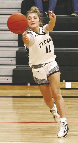 Jacey Nelson passes to an open team mate in action against Hatton-Northwood. Photo by Lyle Van Camp.