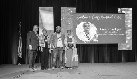 NACo Executive Director Aaron Birst, NDACo President Jayme Tenneson, NDCCA President Joan Hollekim, EICG Award Recipient Revel Sapa, Pembina County Veterans Services Officer. Submitted photo
