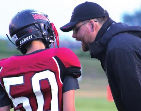 First year head coach Nathan Foster is telling quarterback Gavin Ryan that he did everything right even if the play did not work. VNV photo by Lyle Van Camp