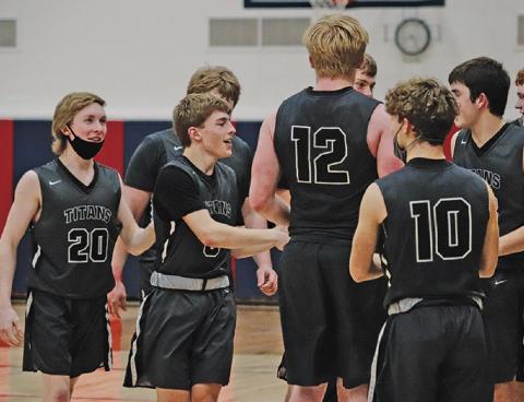 Titans celebrate their win following the Region II play in game in Hope. VNV Photo by Lesa Van Camp