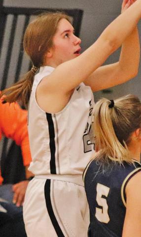 Kiara Aasand goes up for a three point attempt Monday afternoon against North Border in Drayton. VNV Photo by Lesa Van Camp