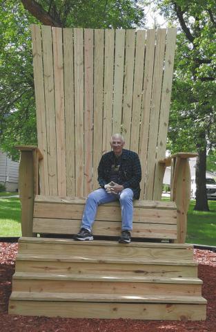 Clint sitting in the camp chair near the Chapel. Photo by Lyle Van Camp.