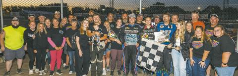 Friends and family surround Tucker, Joey and Kelsi Pederson during the Hall of Fame induction Friday, Aug. 7 at River Cities Speedway in Grand Forks. Photo by Robert Dusso, Dusso Photography