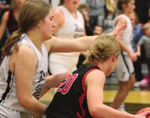 Kiara Aasand puts pressure on the Ball handle in action against Midway-Minto. Photo provided by Drayton Public School - Darla Hoyles