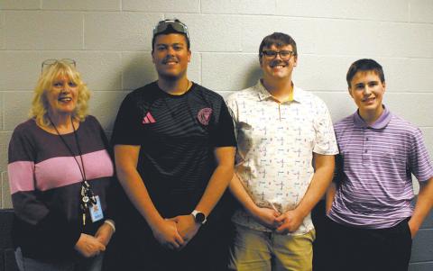 Teacher Sue O’Neil, Daniel De Souza, Ian Peterson, &amp; Loki Sylskar will represent DPS at State. Photo by Jamie Rarick