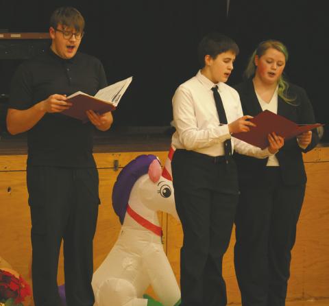 The High School Choir from the left Ian Peterson, Loki Sylskar and Stephanie Kissee. Photo by Lyle Van Camp