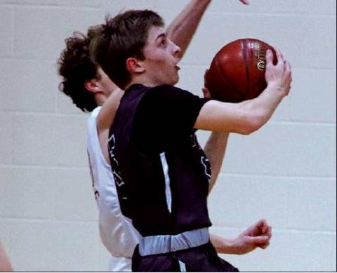 Sam Johnson goes up for two against the Grafton Spoilers last week in the Grafton gym. VNV Photo by Lesa Van Camp