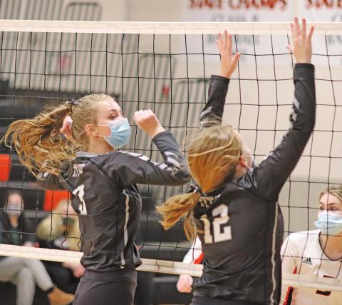 Chloe Gemmill and Aleah Pokrywinski go up for the block against the Cavalier Tornados last Friday night. VNV Photo by Lesa Van Camp