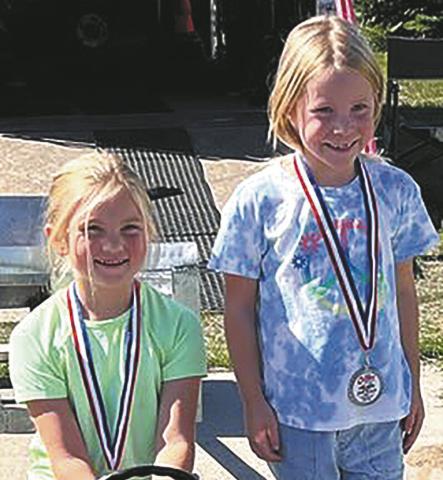 Lydia Moquist and Lakelyn Barten took first and second place in the seven year old division. Submitted photo