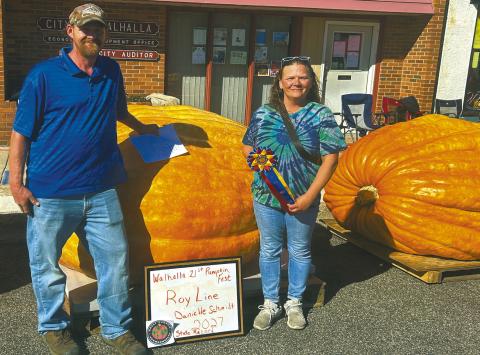 Roy Line and Danielle Schmidt of Grafton with their record-setting pumpkin. Photo by Robert Ripple.