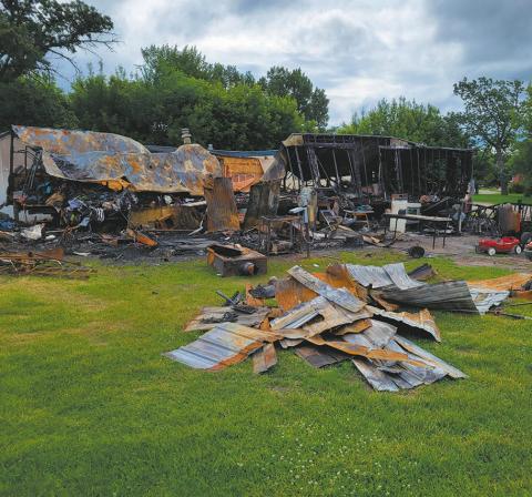 The trailer home at 104 Oak Drive in Grafton was destroyed by a fire in the early morning hours of Thursday, June 24. An adjacent trailer home was also severely damaged. Crews from Grafton and Park River battled the blaze for about four hours. Photo by Mike Allan Steinfeldt