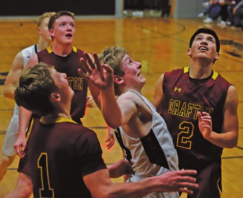 Lucas Anderson boxes out for the rebound against the Grafton Spoilers in the Crystal gym Friday night. VNV photo by Lesa Van Camp