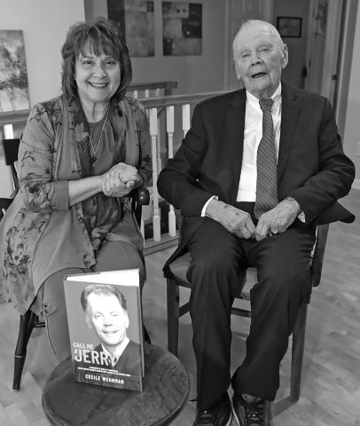 North Dakota’s longest serving Supreme Court Chief Justice Jerry VandeWalle poses with a copy of his biography, “Call Me Jerry” along with author Cecile Wehrman. Photo by Brad Nygaard, The Journal, Crosby.