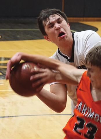 Gage Pollestad fights Larimore’s Avery Gratton for control of the ball. VNV Photo by Lyle Van Camp