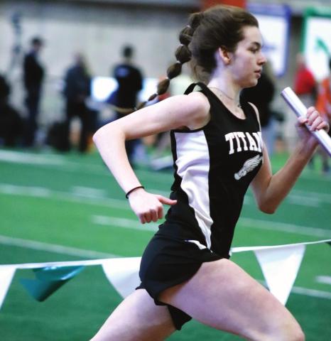 Elizabeth Fedje running in the Girls 1200 Meter Relay. VNV photo by Lyle Van Camp