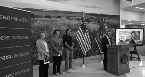 Gov. Armstrong announces the Grain Storage &amp; Facility Rebuilder Program at NDSU. Armstrong was joined by (L-R) Miranda Meehan, NDSU Extension disaster coordinator, James Burgum, CEO at The Arthur Companies, and Steve Johnson, farmer from Page, ND.