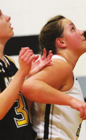 Hailey Berg concentrates on a rebound in action against Park River. Photo provided by Drayton Public School Darla Hoyles