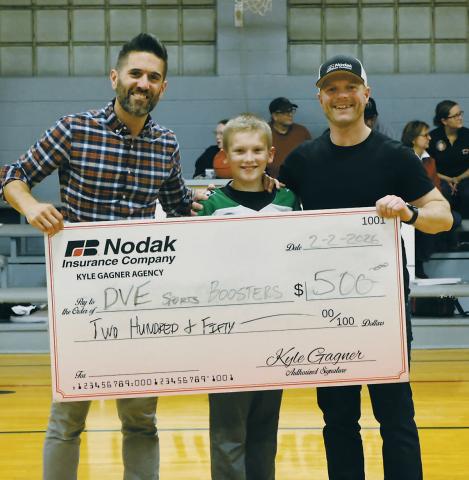 At half-time, a check was presented by Kyle Gagner of Nodak Insurance, pictured with Kyle Johnson and Ryan Beattie. Photo by Jamie Rarick