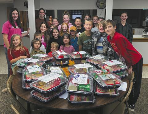 Crystal Clovers 4-H members show off their shelf-stable cake kits. Submitted photo.