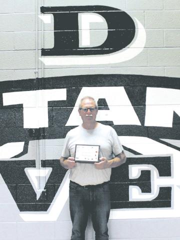 Drayton Coach Murph Thompson was recognized at Friday's volleyball game and presented with a plaque for 45 years of coaching service by the North Dakota High School Coaches Association. Photo by Jamie Rarick.
