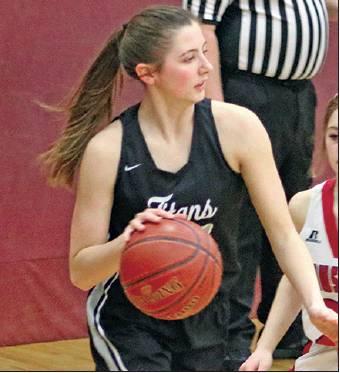 Emilee Reilly drives the ball around one of the Mustangs in Minto last week. Photo submitted by Kerri Stegman, Drayton Public School