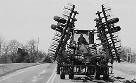 The responsibility of safely sharing the road during spring planting season falls on both farm equipment operators and general motorists. Upper Midwest Agricultural Safety and Health photo
