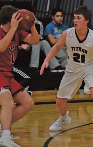 Alex Swanson guards Patriot Josh Evans last Thursday night in the Drayton gym. VNV Photo by Lesa Van Camp