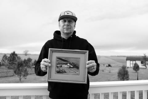 Farmer Tyler Stafslien stands in front of storage silos holding grain and soybeans in Ryder, North Dakota on Nov. 14, 2025. The tariff war with China forced Stafslien to store more of his soybeans this harvest season. Photo: Gabrielle Nelson/Buffalo’s Fire