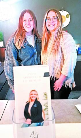 Dr. Jules Efta (right) serves Drayton along with a high school friend turned employee, Kassidy Hanson.Photo by Christine Jensen