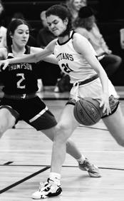 Elizabeth Fedje drives the ball past Sydney Schwabe. Photo by Lyle Van Camp